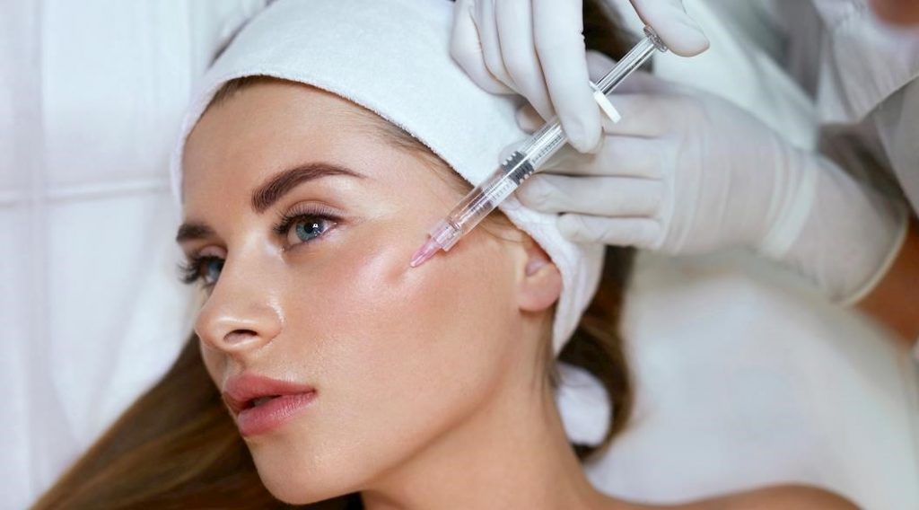 Image of a woman getting a Dermal Filler injection.